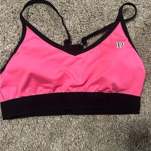Pink sports bra size medium but fits more like a small